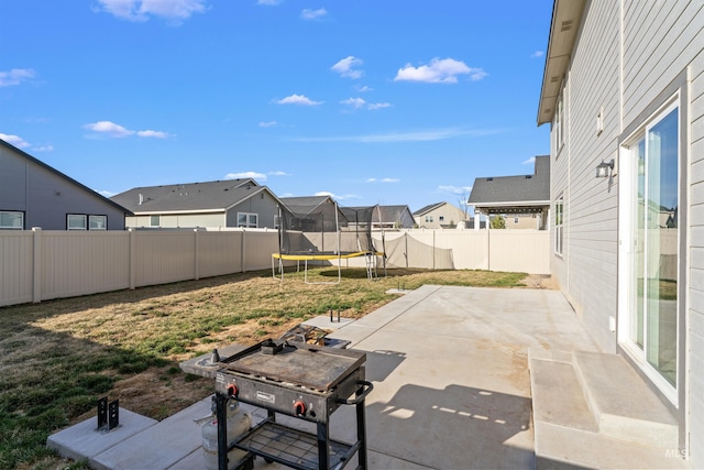 3749 E Rock Falls St, Nampa, ID 83686 - view of patio / terrace featuring a residential view, a trampoline, and a fenced backyard