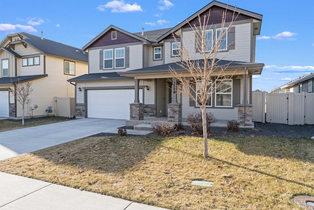3749 E Rock Falls St, Nampa, ID 83686 - craftsman-style house featuring a gate, concrete driveway, covered porch, fence, and a garage