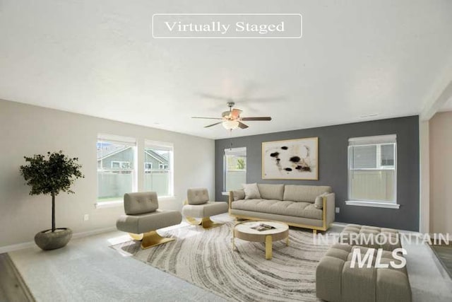 3749 E Rock Falls St, Nampa, ID 83686 - living area with a ceiling fan and baseboards