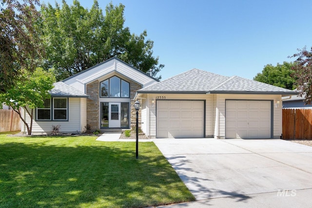 12335 W Red Spruce, Boise, ID 83713 - view of front of house featuring an attached garage, driveway, and roof with shingles