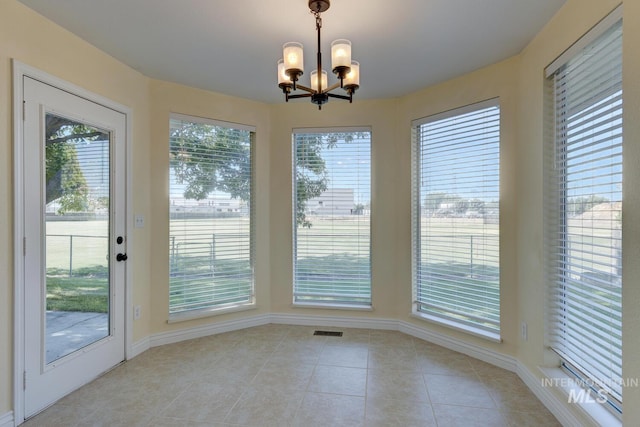 12335 W Red Spruce, Boise, ID 83713 - unfurnished dining area featuring a chandelier and light tile patterned flooring