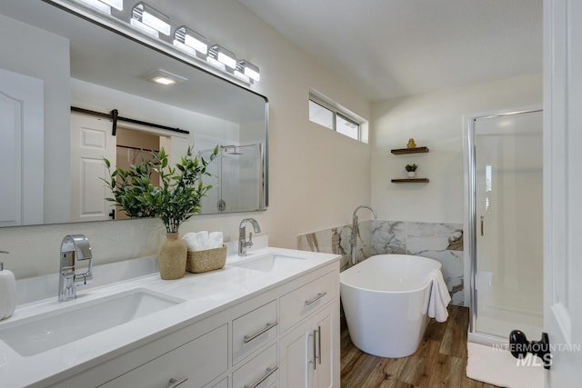 12335 W Red Spruce, Boise, ID 83713 - full bathroom featuring a stall shower, wood finished floors, double vanity, and a freestanding tub