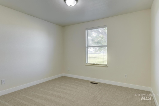 12335 W Red Spruce, Boise, ID 83713 - spare room featuring light carpet and baseboards