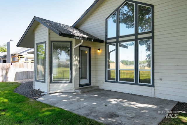12335 W Red Spruce, Boise, ID 83713 - doorway to property with a patio area and roof with shingles