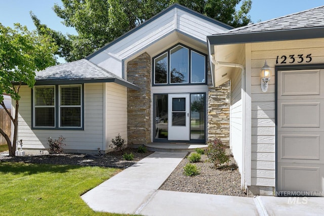 12335 W Red Spruce, Boise, ID 83713 - property entrance with stone siding and a yard