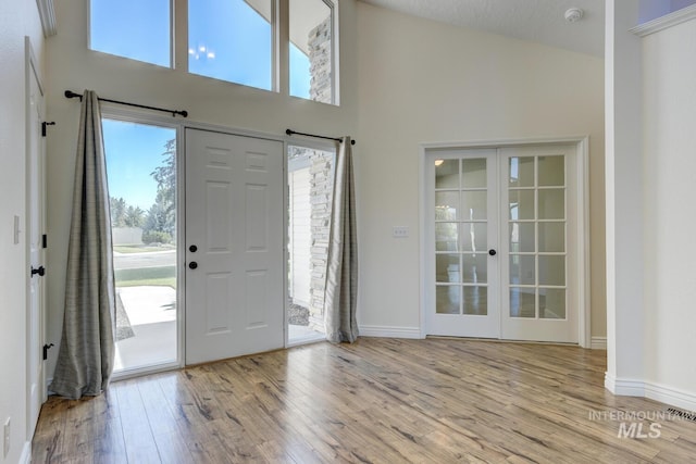 12335 W Red Spruce, Boise, ID 83713 - foyer featuring a high ceiling, plenty of natural light, and wood finished floors