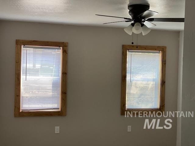 spare room featuring ceiling fan