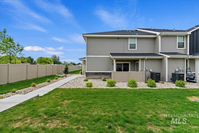 2312 E Spice Loop Unit 3, Nampa, ID 83687 - rear view of house featuring central AC unit