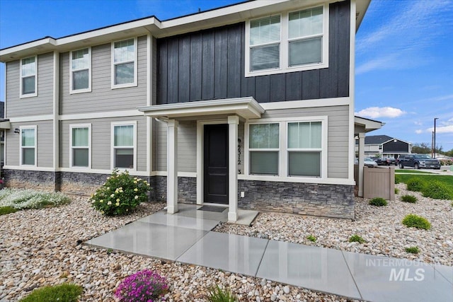 2312 E Spice Loop Unit 3, Nampa, ID 83687 - view of front of property featuring stone siding and board and batten siding