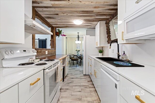 kitchen featuring white cabinetry, white appliances, wood ceiling, light wood-type flooring, and wall chimney exhaust hood