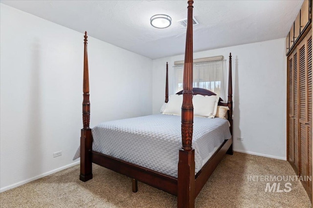 bedroom featuring a closet and carpet flooring