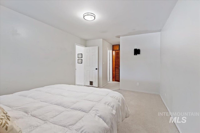 bedroom with light colored carpet