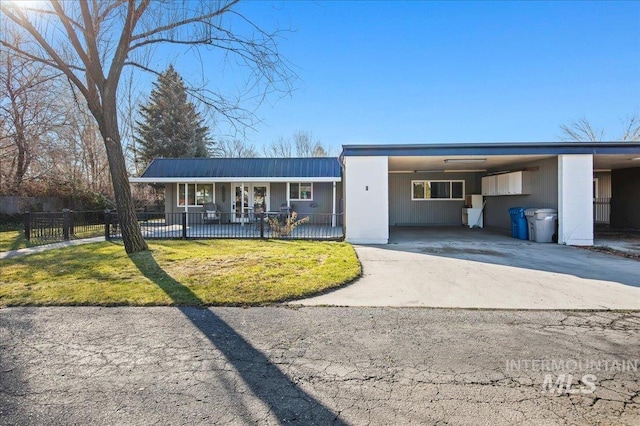 single story home with a carport, a porch, and a front lawn