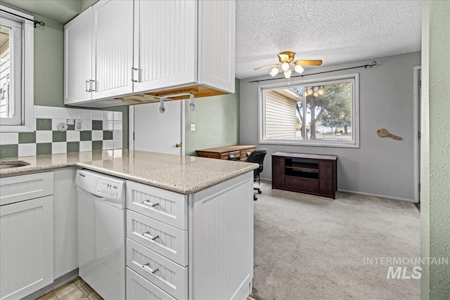 1267 NW Beaman St, Mountain Home, ID 83647 - kitchen with dishwasher, white cabinets, a ceiling fan, decorative backsplash, and a textured ceiling