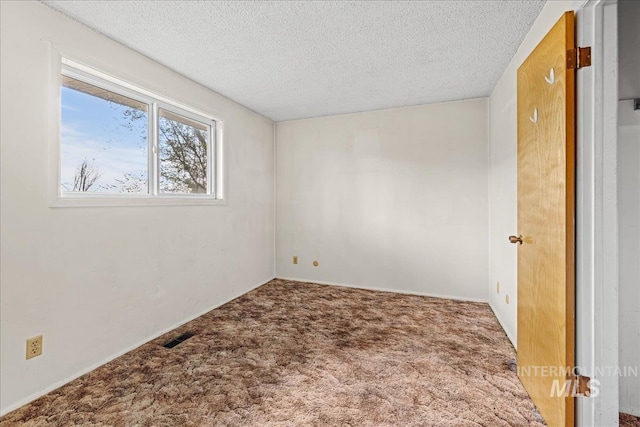 1267 NW Beaman St, Mountain Home, ID 83647 - spare room with carpet floors and a textured ceiling