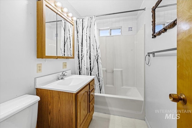1267 NW Beaman St, Mountain Home, ID 83647 - full bath featuring toilet, shower / bath combo with shower curtain, vanity, and tile patterned flooring