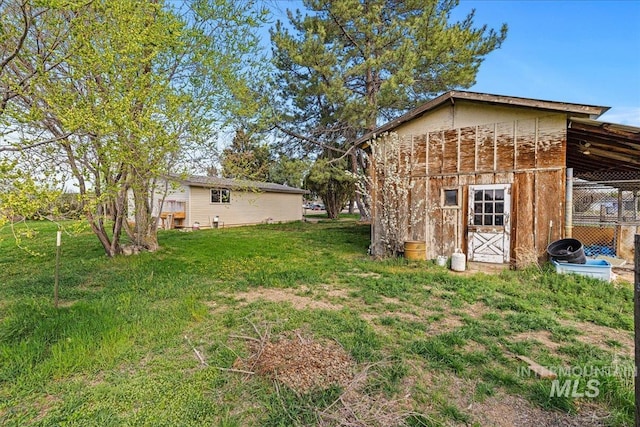 1267 NW Beaman St, Mountain Home, ID 83647 - view of green lawn with an outdoor structure