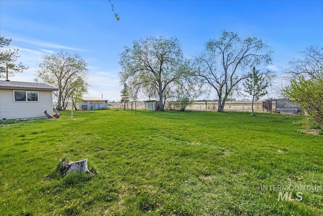 1267 NW Beaman St, Mountain Home, ID 83647 - view of yard with a storage shed and an outdoor structure