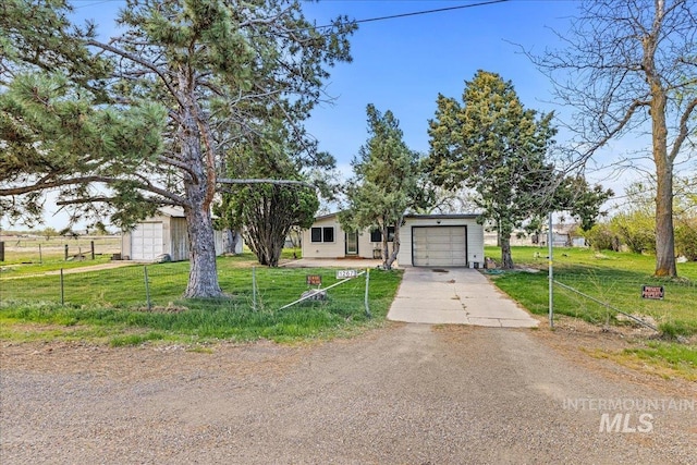 1267 NW Beaman St, Mountain Home, ID 83647 - view of front of property with concrete driveway and a garage