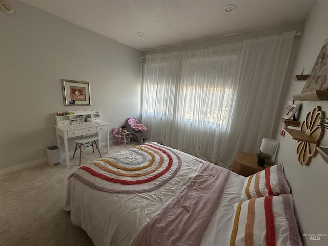 bedroom featuring baseboards and carpet floors