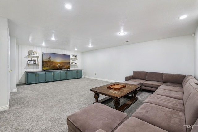 living room with recessed lighting, baseboards, and carpet floors