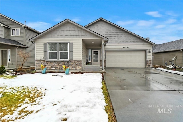 view of front of property featuring stone siding, concrete driveway, and an attached garage