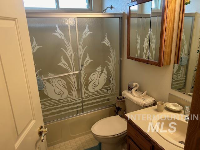 1100 Burnett Dr Unit 348, Nampa, ID 83651 - bathroom with shower / bath combination with glass door, vanity, and toilet
