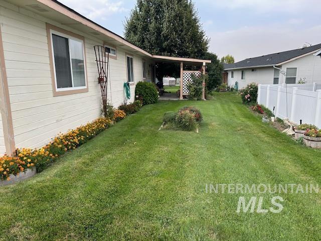 1100 Burnett Dr Unit 348, Nampa, ID 83651 - view of yard featuring fence