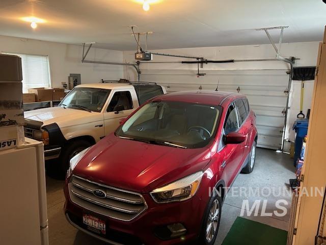 1100 Burnett Dr Unit 348, Nampa, ID 83651 - garage featuring a garage door opener