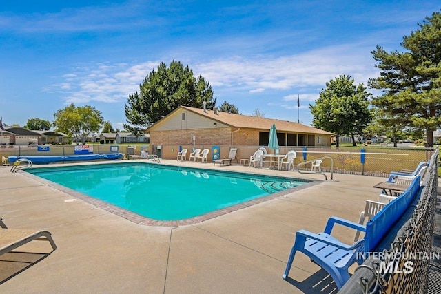 1100 Burnett Dr Unit 348, Nampa, ID 83651 - pool featuring a patio and fence