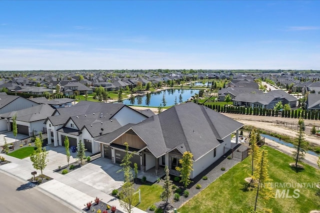 aerial perspective of suburban area with a nearby body of water