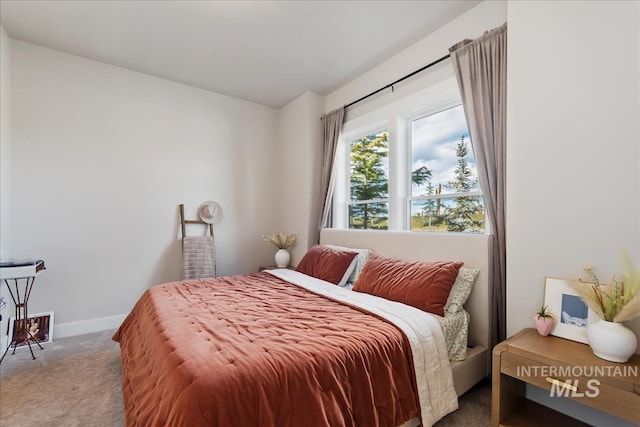 bedroom with carpet and baseboards
