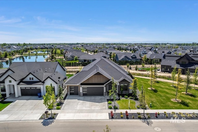 aerial perspective of suburban area featuring a nearby body of water
