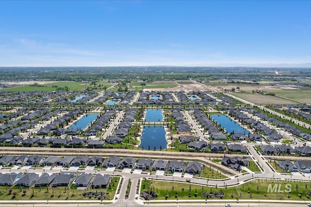 view of property location featuring nearby suburban area and a nearby body of water