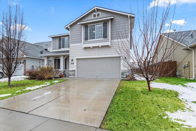 traditional-style home with a front lawn, concrete driveway, and an attached garage