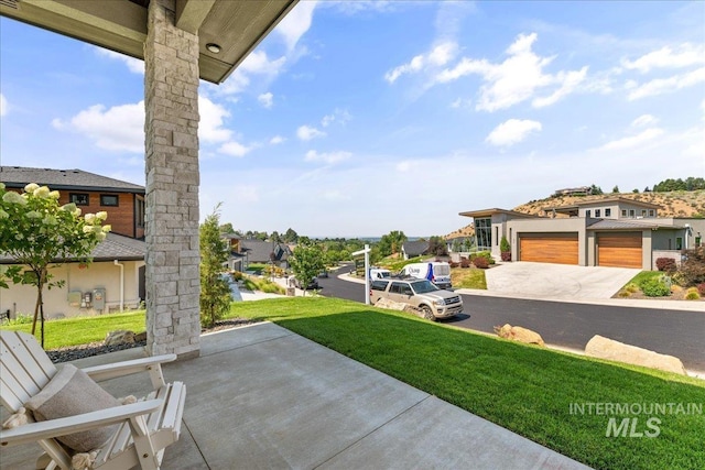 view of patio / terrace with a garage