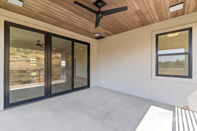 view of patio featuring ceiling fan