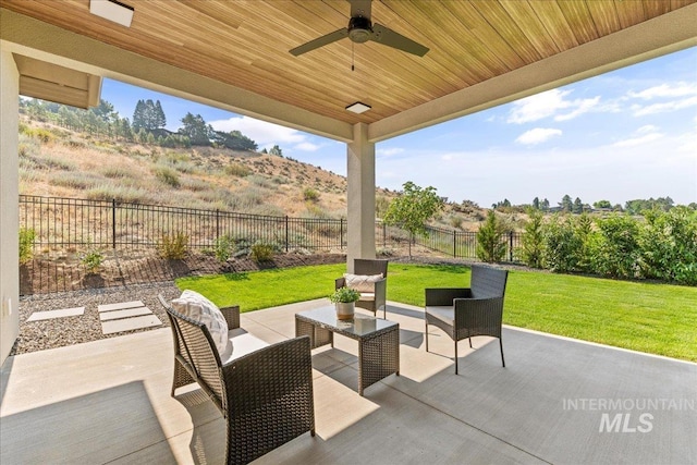 view of patio featuring ceiling fan and an outdoor living space