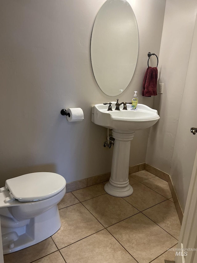 140 W Valley Rd, Hagerman, ID 83332 - half bath with toilet, tile patterned floors, and baseboards