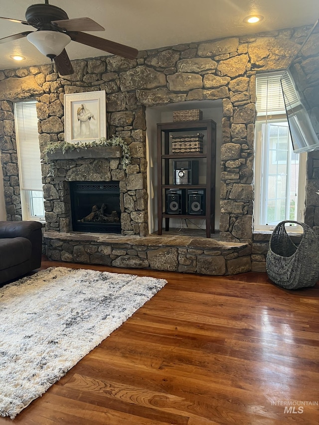 140 W Valley Rd, Hagerman, ID 83332 - living room featuring a fireplace, wood finished floors, and ceiling fan