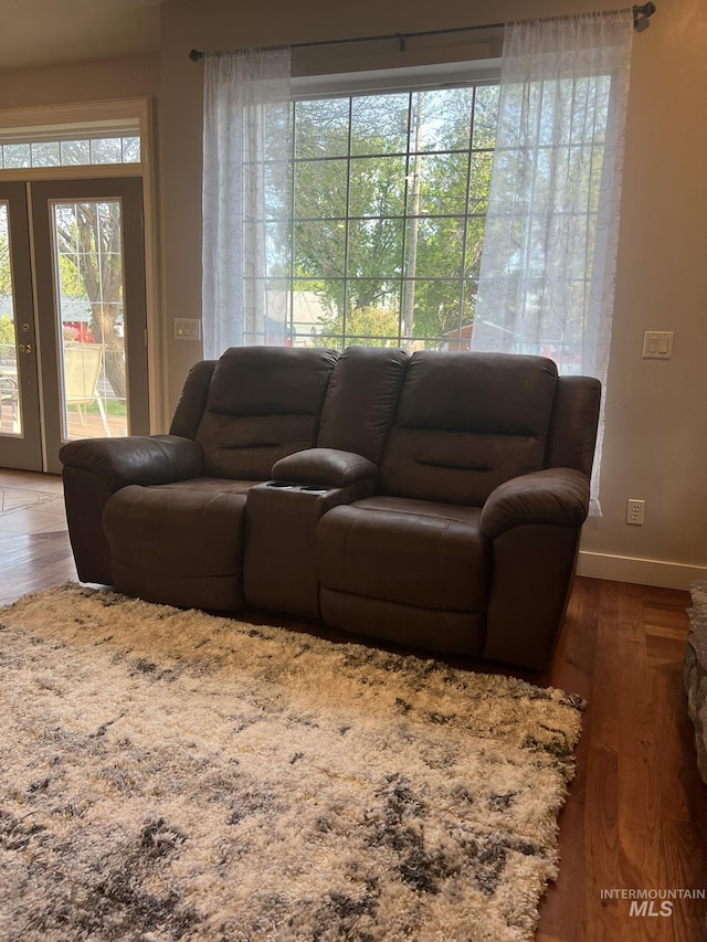 140 W Valley Rd, Hagerman, ID 83332 - living room featuring wood finished floors, baseboards, and french doors