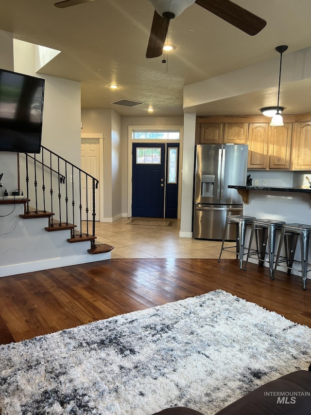 140 W Valley Rd, Hagerman, ID 83332 - foyer entrance featuring ceiling fan, light wood-style flooring, baseboards, and stairs