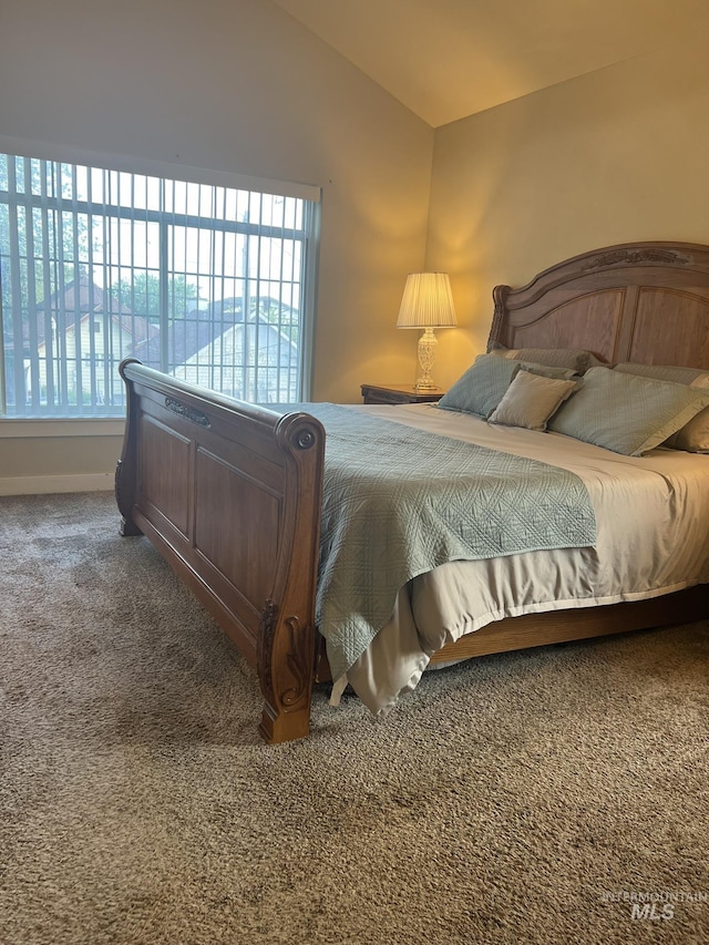 140 W Valley Rd, Hagerman, ID 83332 - carpeted bedroom with multiple windows, vaulted ceiling, and baseboards