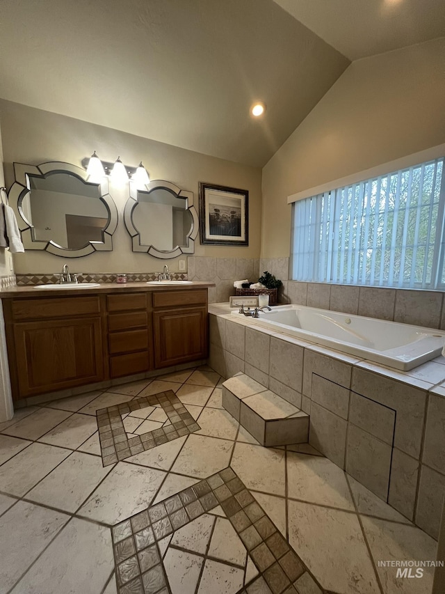 140 W Valley Rd, Hagerman, ID 83332 - bathroom with vaulted ceiling, a bath, double vanity, and recessed lighting