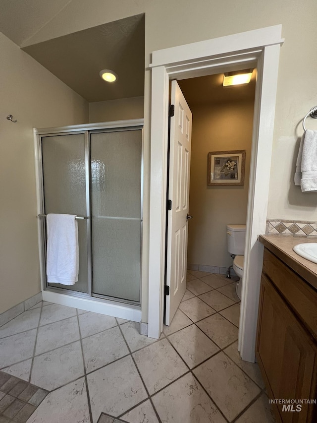 140 W Valley Rd, Hagerman, ID 83332 - bathroom with toilet, a stall shower, vanity, and tile patterned floors