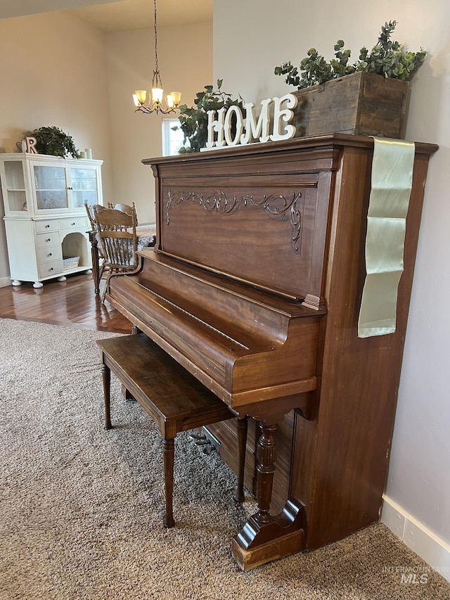 140 W Valley Rd, Hagerman, ID 83332 - detailed view of a chandelier, wood finished floors, and baseboards