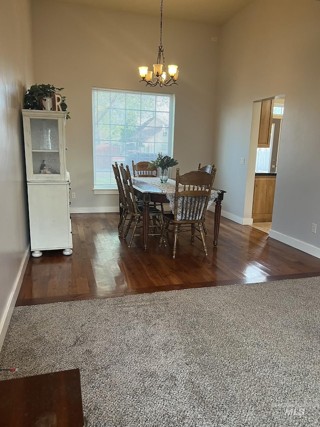 140 W Valley Rd, Hagerman, ID 83332 - dining room with a chandelier, baseboards, and wood finished floors