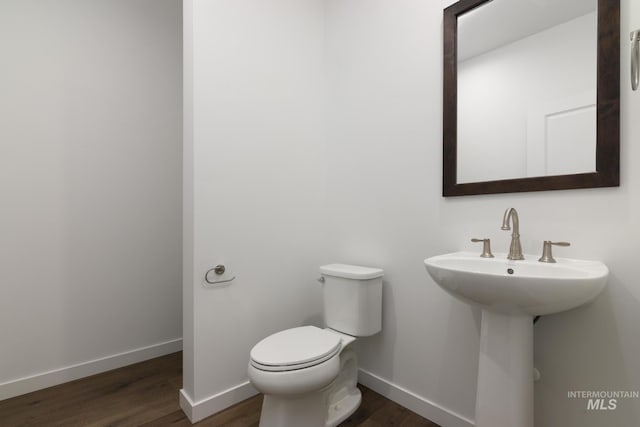 bathroom featuring toilet and hardwood / wood-style floors