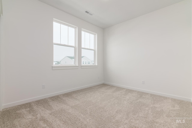 unfurnished room with carpet floors