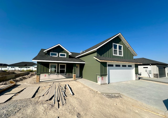 view of front facade featuring a garage and covered porch